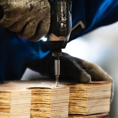 Wooden crate being drilled
